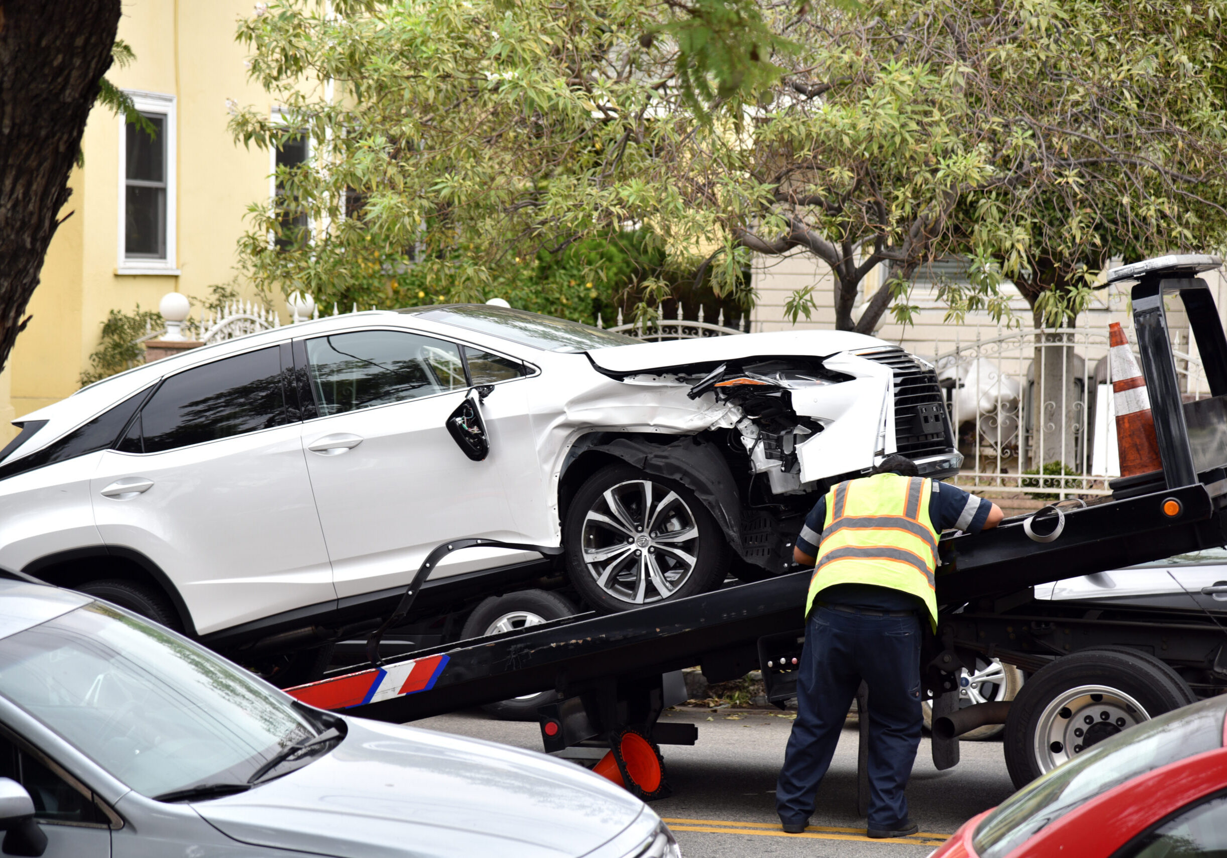 A,Tow,Truck,Driver,Loading,A,Wrecked,Car,Onto,A A,Tow,Truck,Driver,Loading,A,Wrecked,Car,Onto,A
